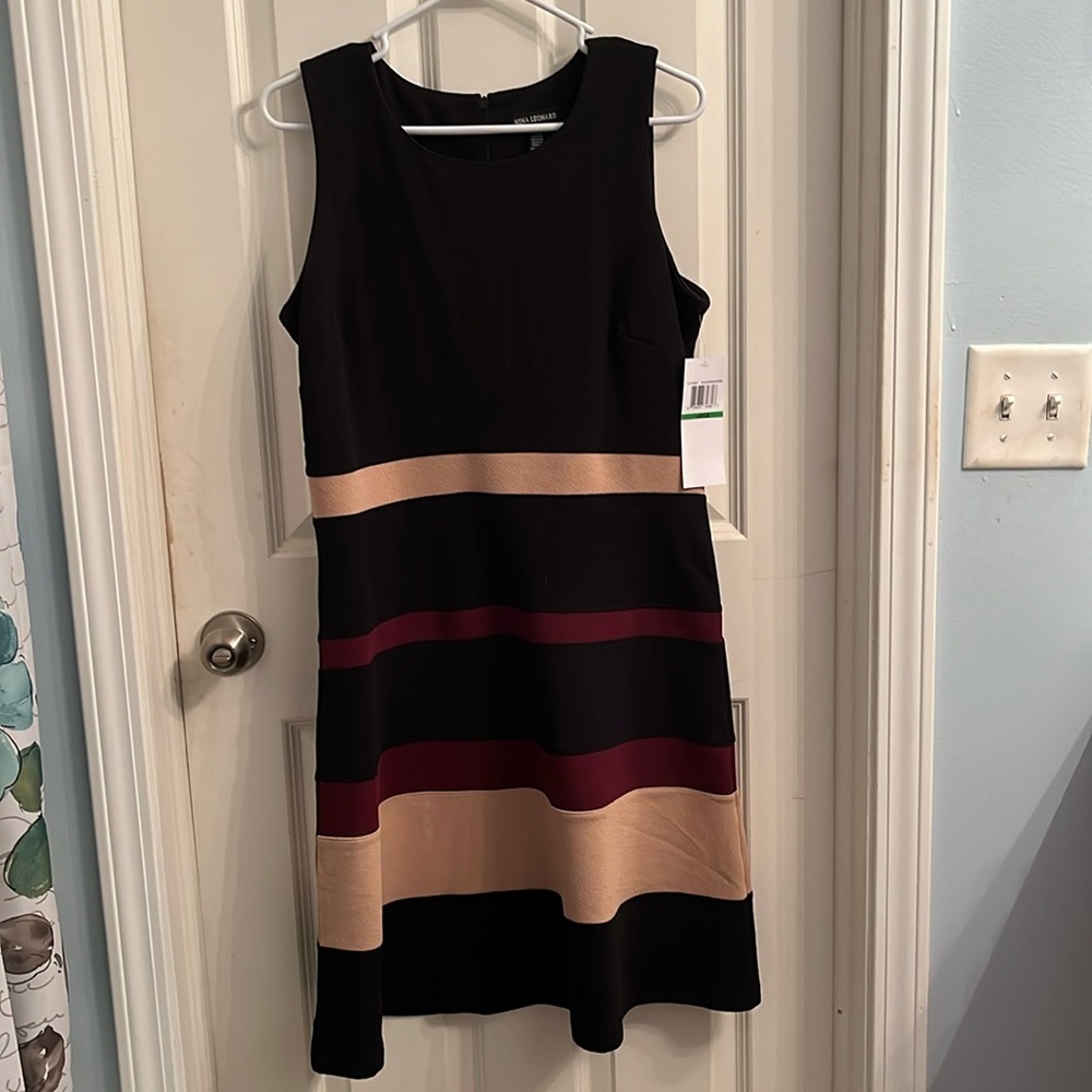 Black, tan, and maroon striped fit and flare sleeveless dress. Stretch fabric